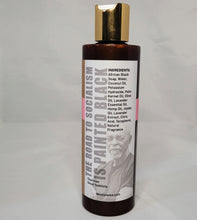 Load image into Gallery viewer, African Black Castile Body Wash and Shampoo 8 oz bottle with gold cap, showing back of label with quote that says, THe road to soacialism is painted black by Omali Yeshitela.