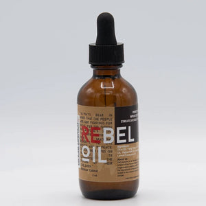 Rebel Oil 2 oz in amber glass bottle with black dropper top