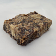 Load image into Gallery viewer, Authentic African black soap bar centered on a white background